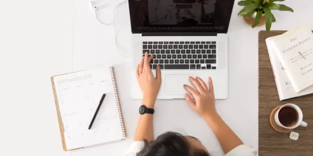 person using MacBook Pro learning
