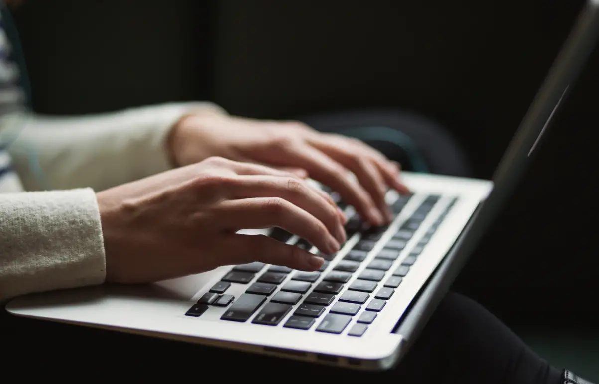 person-using-laptop-keyboard