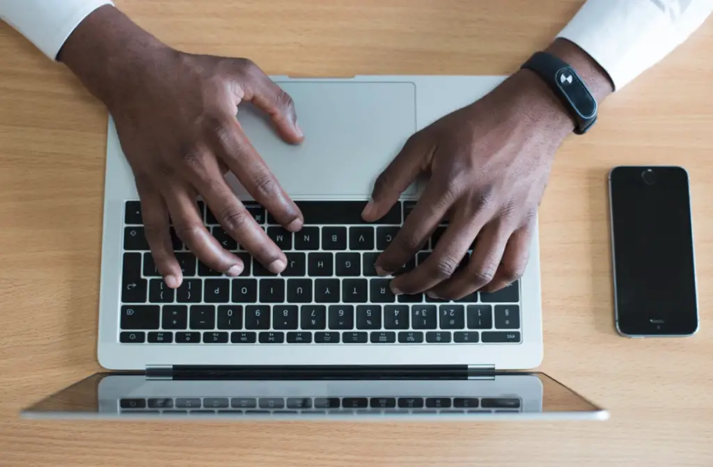 man hands computer taping